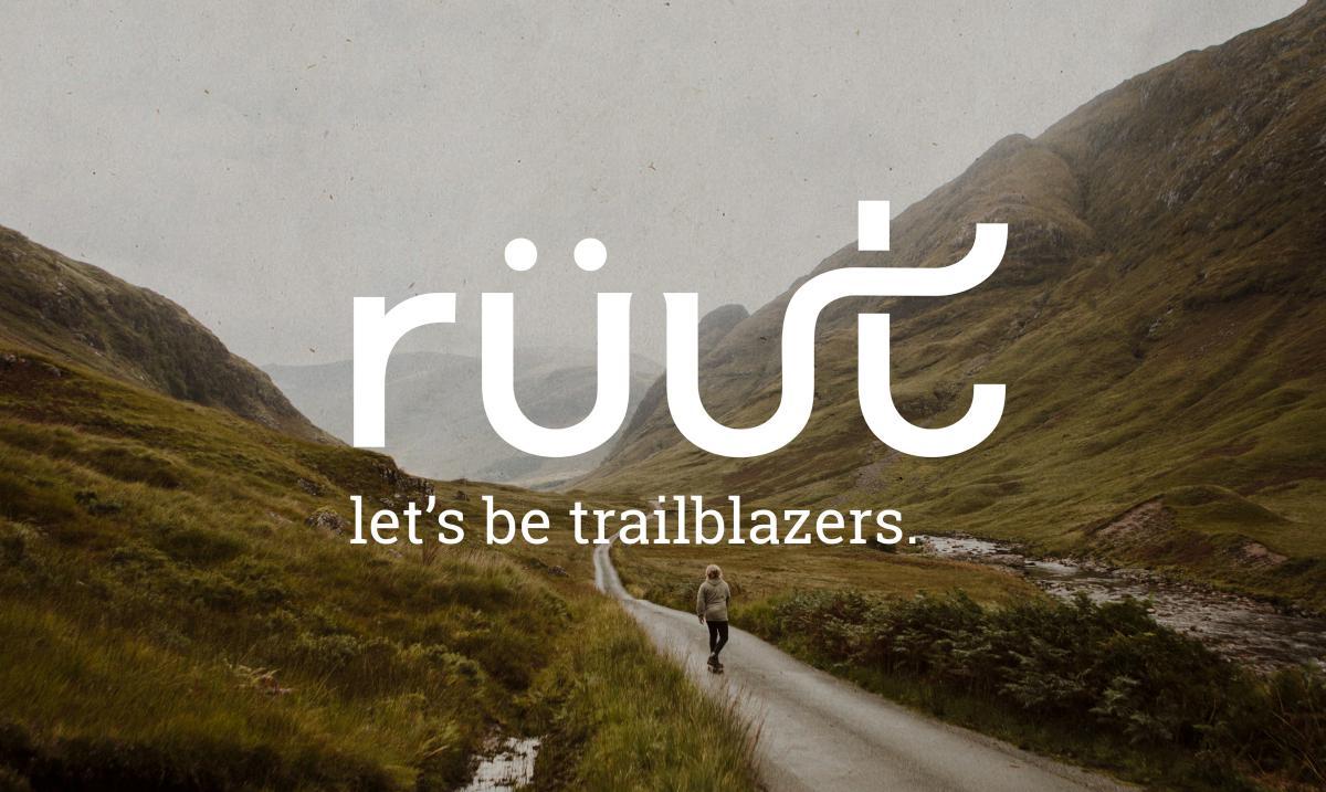 picture of road going through two mountains in the fog, white letters reading ruut are transposed over image