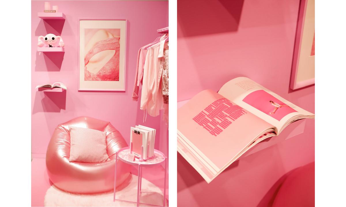 photograph of pink set with chair and shelves, all in pink with painted bright pink wall behind it all