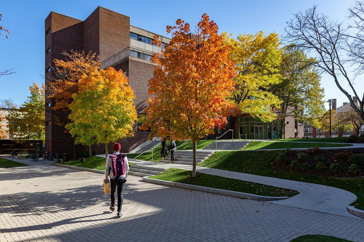 student walking on doble campus