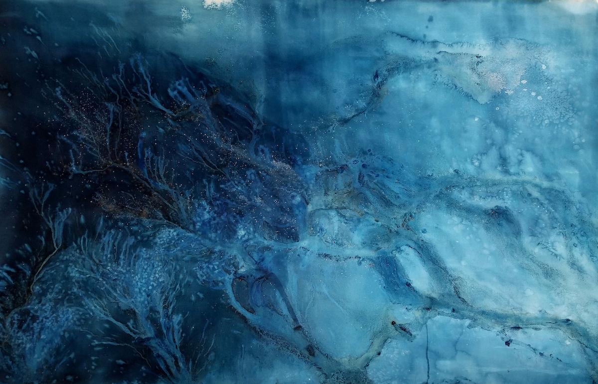 dark and light blues blended together in a watercolor style 
