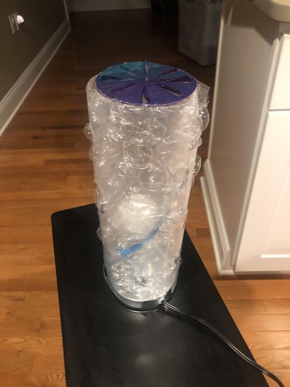 Homemade lamp on a table, not lit up
