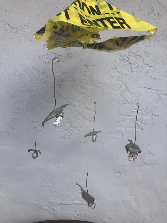 Hanging mobile with caution tape, shells, copper wire and blue/green metal sting rays