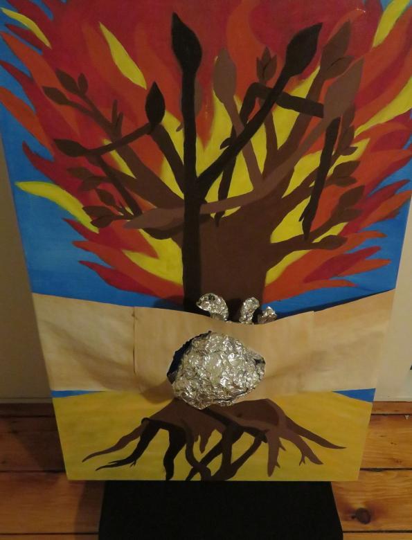 Painting of colorful tree with tin foil attached to the painting