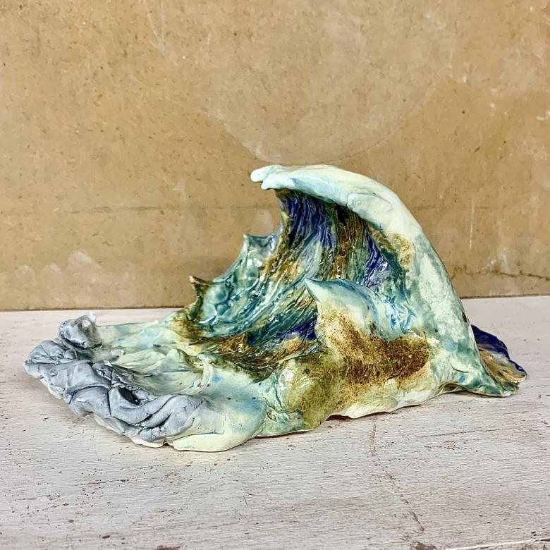 sculpture of an ocean wave (photo is of left side of sculpture)