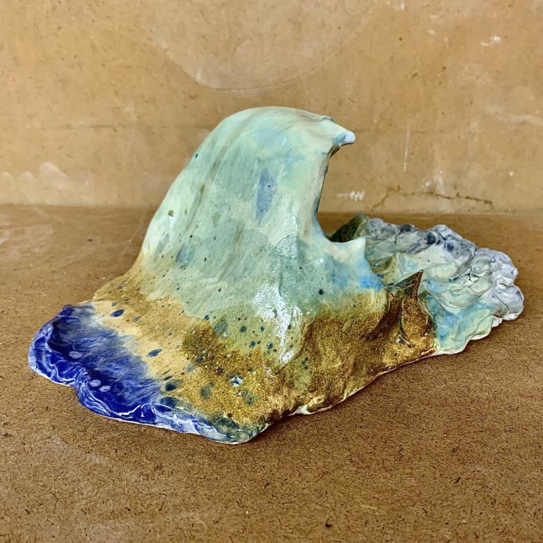 sculpture of an ocean wave (photo is of back of sculpture)