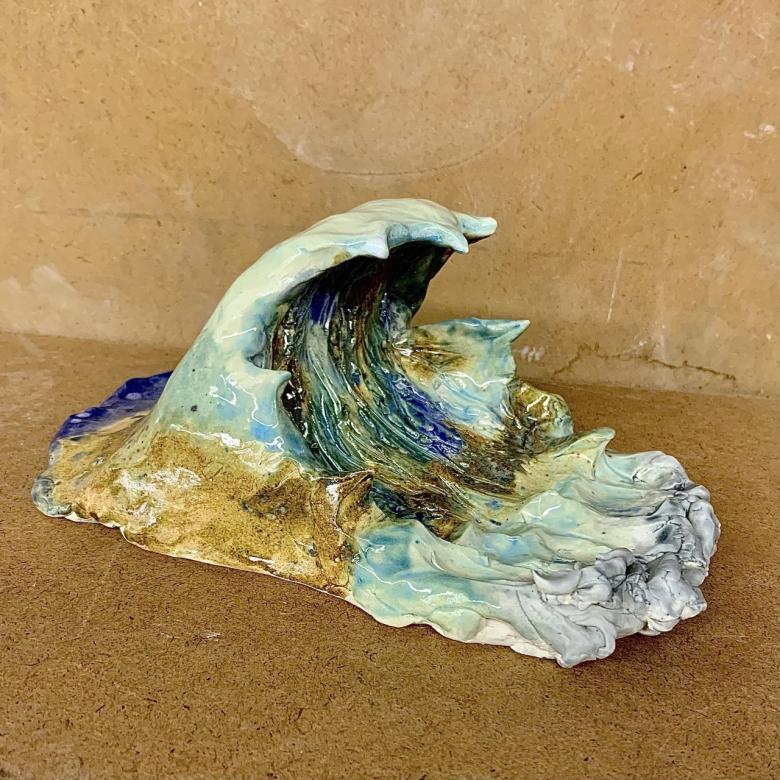 sculpture of an ocean wave (photo is of right side of sculpture)