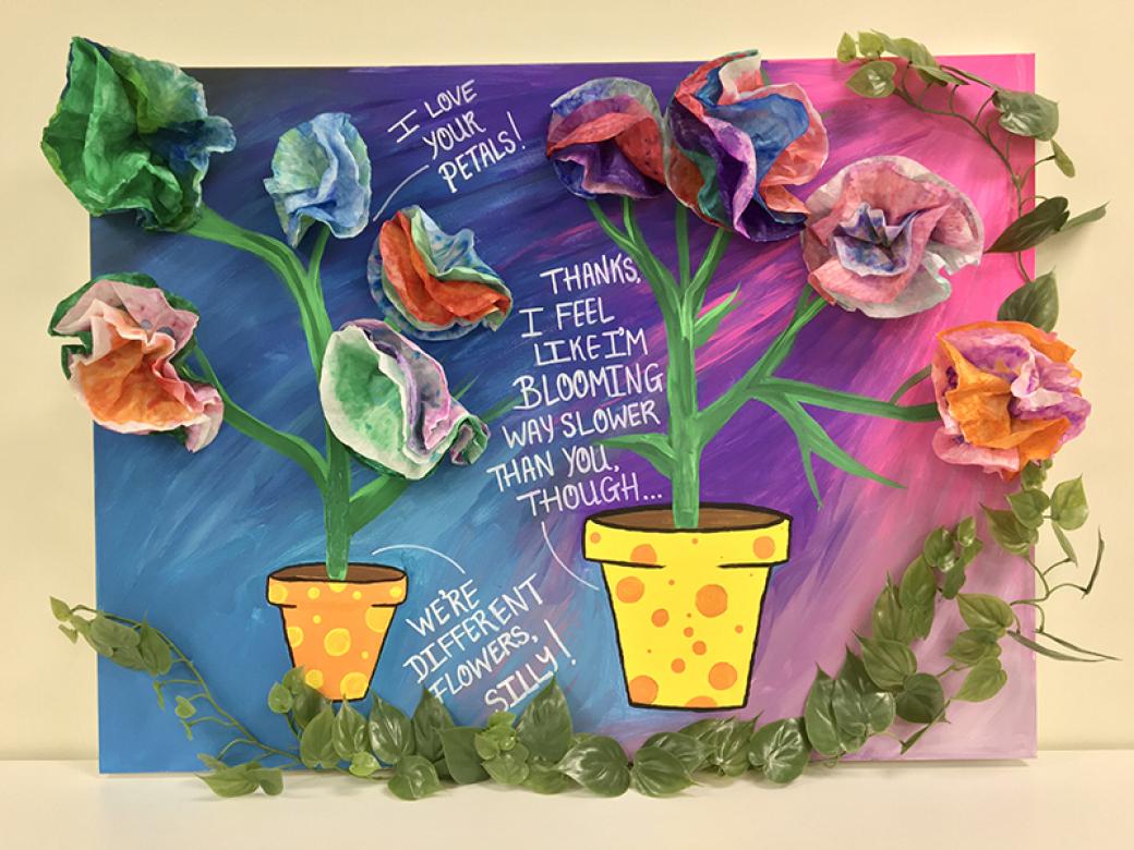An acrylic painting of two flower pots, varying in size.  The smaller pot is orange with yellow polka dots, and the larger pot is yellow with orange polka dots.  Both pots are centered on a blue and pink gradient background.  Flower stems grow out of the pots, and on those stems are multicolored, 3-dimensional coffee filter flowers.  The background is several different shades of blue, purple, and pink swirled together to complement the colors of the flowers. Bordering the flowers are vines and leaves.  In t