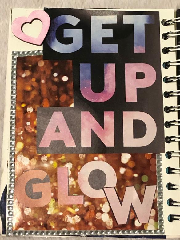 Page eleven reads in big colorful letters “GET UP AND GLOW” with a shiny gold background and silver jewels around the border. A wooden heart colored pink sits in the upper left hand corner of the page. 