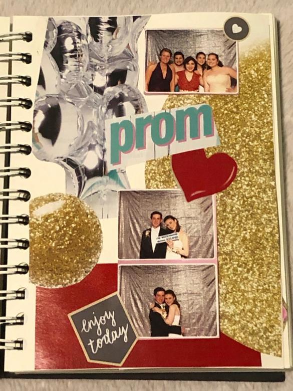21. Page twenty features a sparkly gold and red background. A cut out picture of silver balloons is shown at the top of the page with two pictures of me (age sixteen) with friends and my boyfriend at prom. The word “prom” reads in the center of the page with little grey stickers and a cut out red heart.