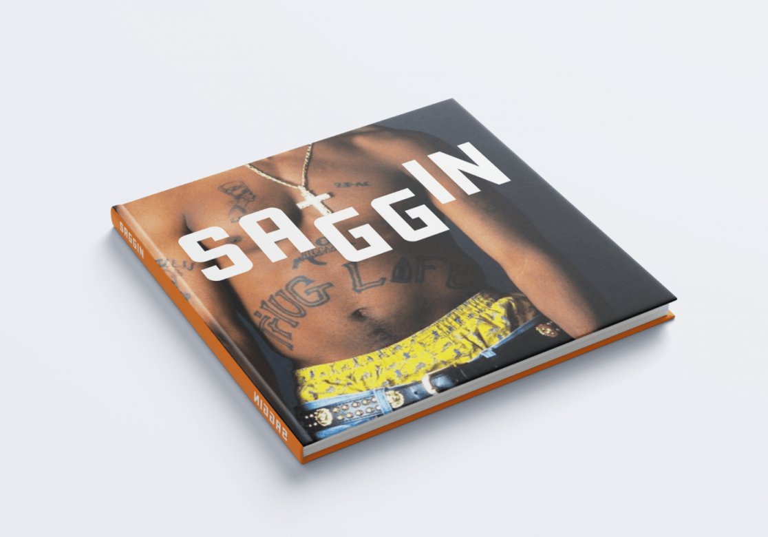 Front cover of a book that depicts the torso of a tattooed Black man. The title of the book syas "Saggin."