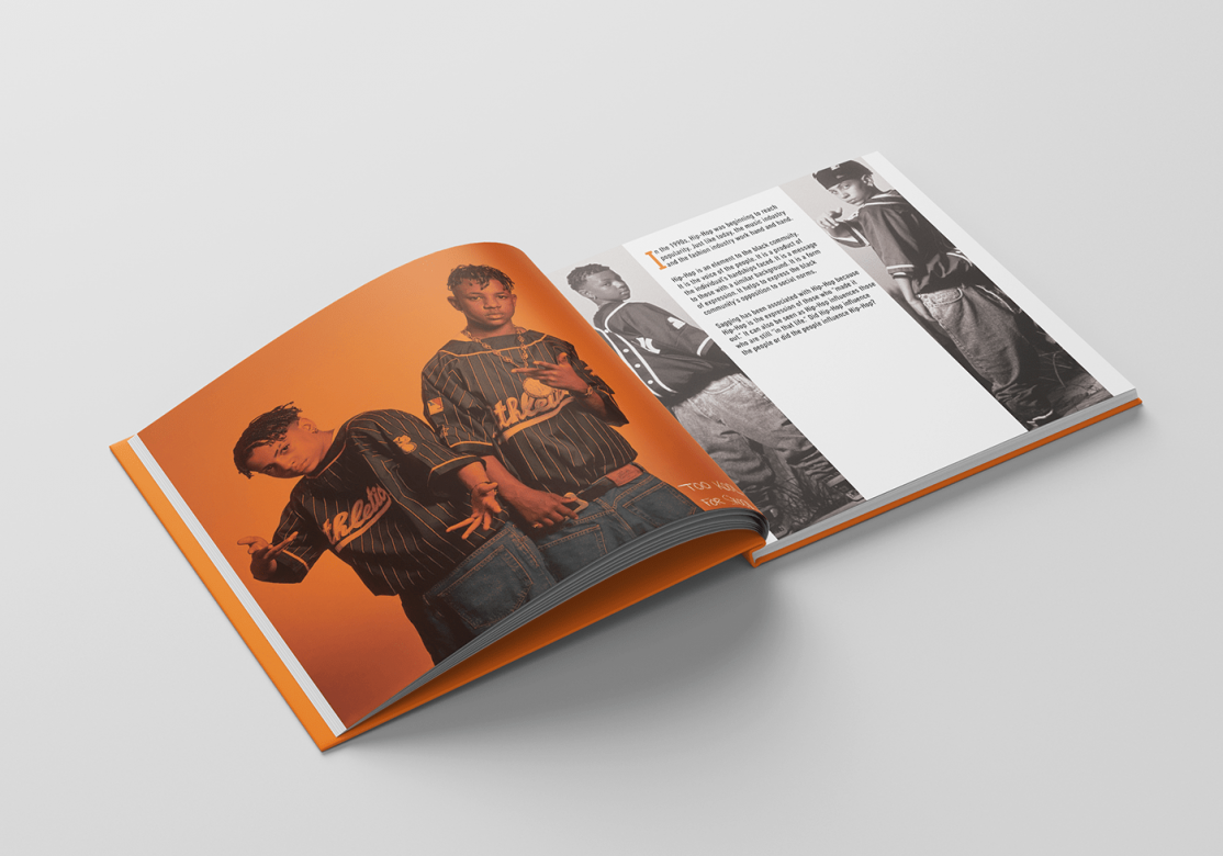 "Saggin" book open. On the left, an orange image of two young Black boys wearing clothes backwards. On the right is a paragraph explaining how sagging became associated with hip-hop.