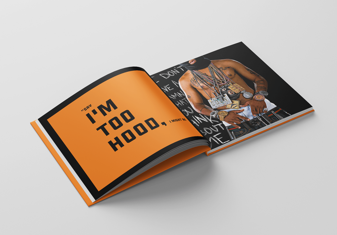 "Saggin" book open. On the left in large black text on an orange background is a quote, "Say I'm too hood, I might be." On the right is a Black man's torso. He wears sagging pants, a black ski mask, and large chains. 