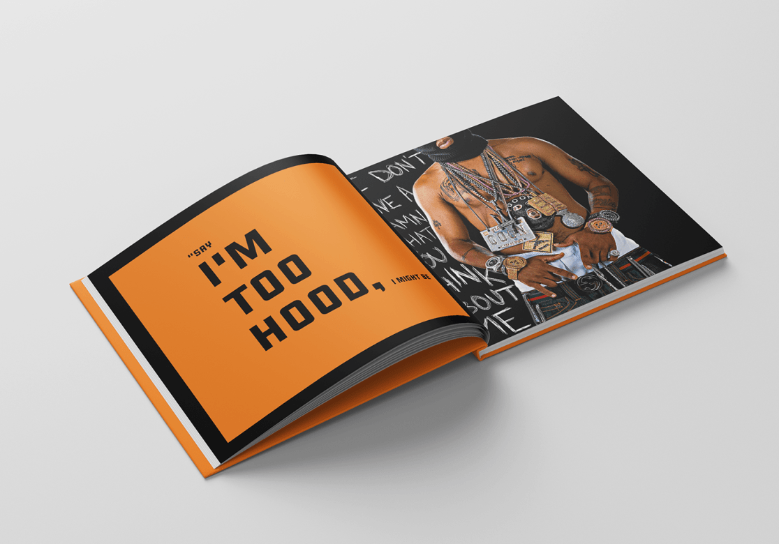 "Saggin" book open. On the left in large black text on an orange background is a quote, "Say I'm too hood, I might be." On the right is a Black man's torso. He wears sagging pants, a black ski mask, and large chains. 