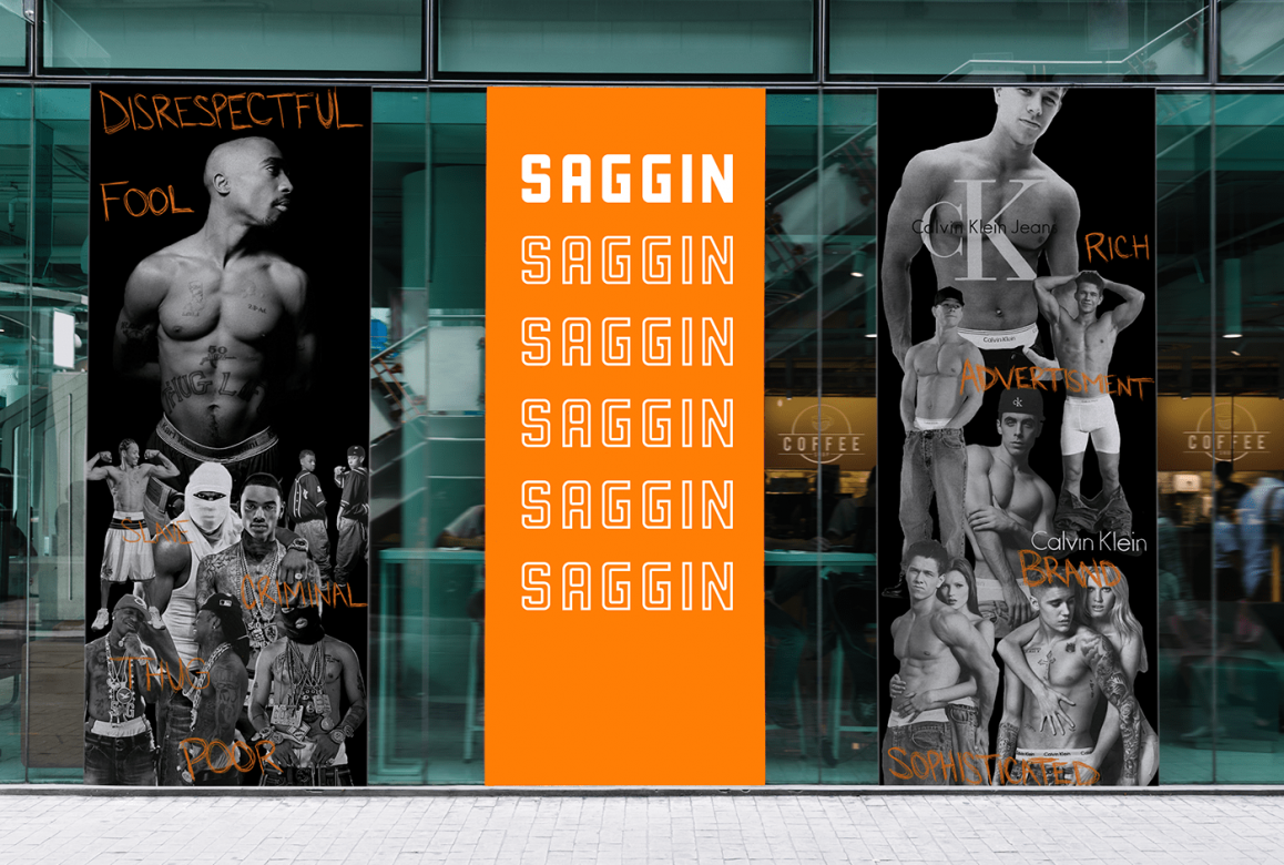 Three vertical panels installed on a storefront. The leftmost panel depicts Tupac Shakur and other Black men wearing sagging pants. Written on top of the images in orange are words, "Disrespectful fool, slave, criminal, thug, poor." The middle panel is all orange with the word "saggin" repeated in white. On the rightmost panel are images of white celebrities like Mark Wahlberg and Justin Bieber wearing sagging pants. Written on top of the images are words, "Rich, advertisement, brand, sophisticated."