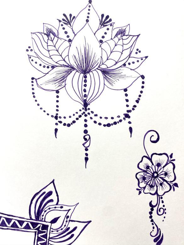 Blue ink drawing of a decorative lotus motif in the upper center of a white vertical piece of paper with a smaller decorative floral design in the bottom left and right corners