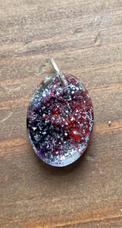 sparkly red, black and purple charm for a necklace