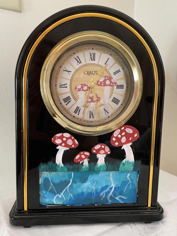 photo of a clock with mushrooms painted on it