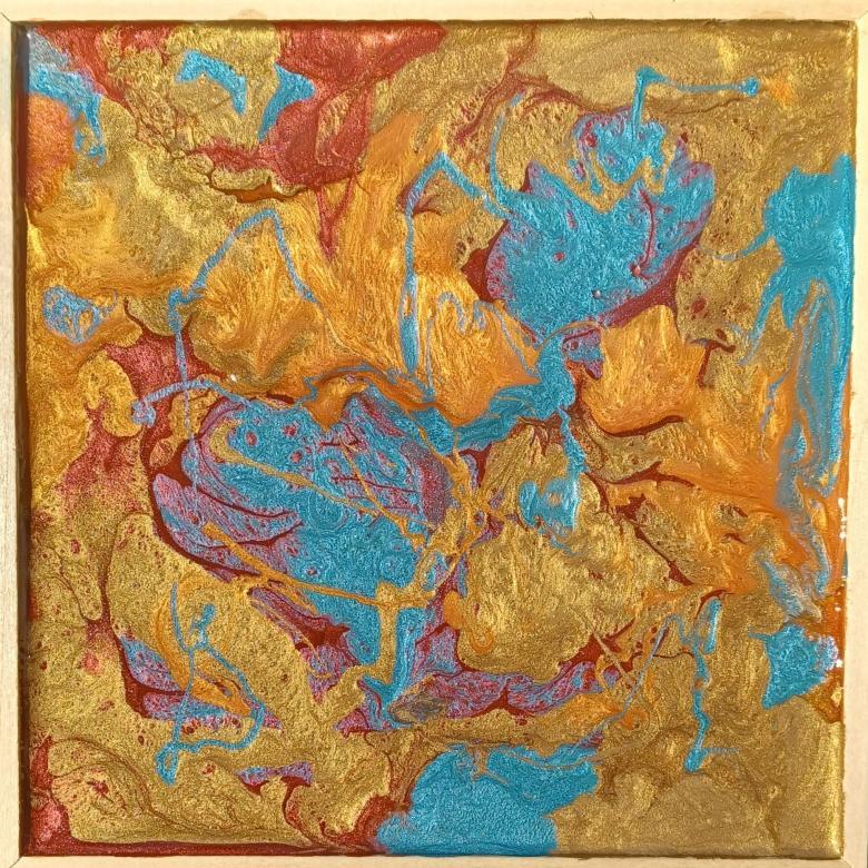 An abstract painting of several different colors. Metallic gold, orange, and light blue make up most of the space with some dark red seeps in between the small spaces between these colors. The colors are intermixed with each other in variously sized segments.