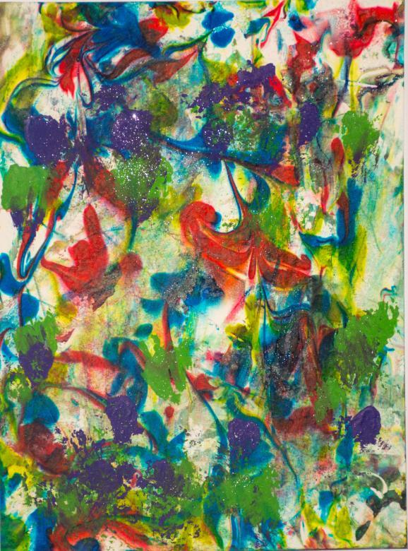 This piece is made up of several colors marbled on the page creating intricate swirls. The colors are red, yellow, green, purple, and blue. In some spots there is silver glitter.