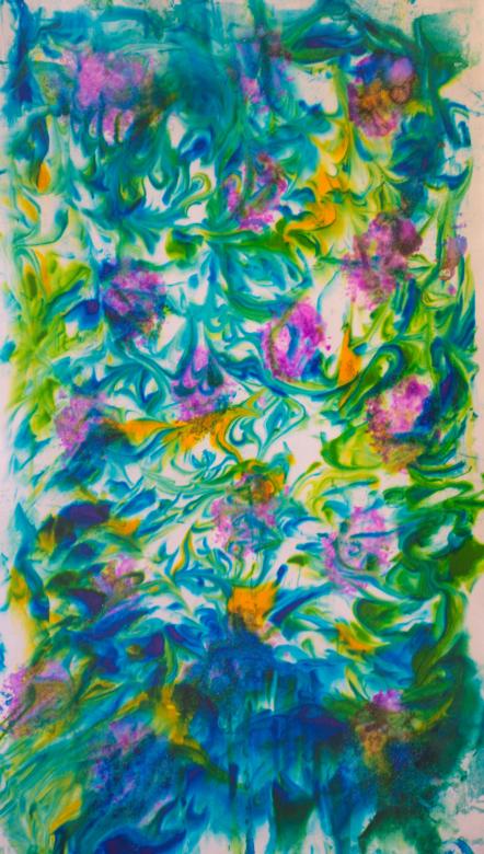 This piece is made up of several colors all marbled together. The colors are blue, yellow, and green. The outer edges are much more blue and the center is much more green and yellow. On top of these colors are splotches of pink paint. 