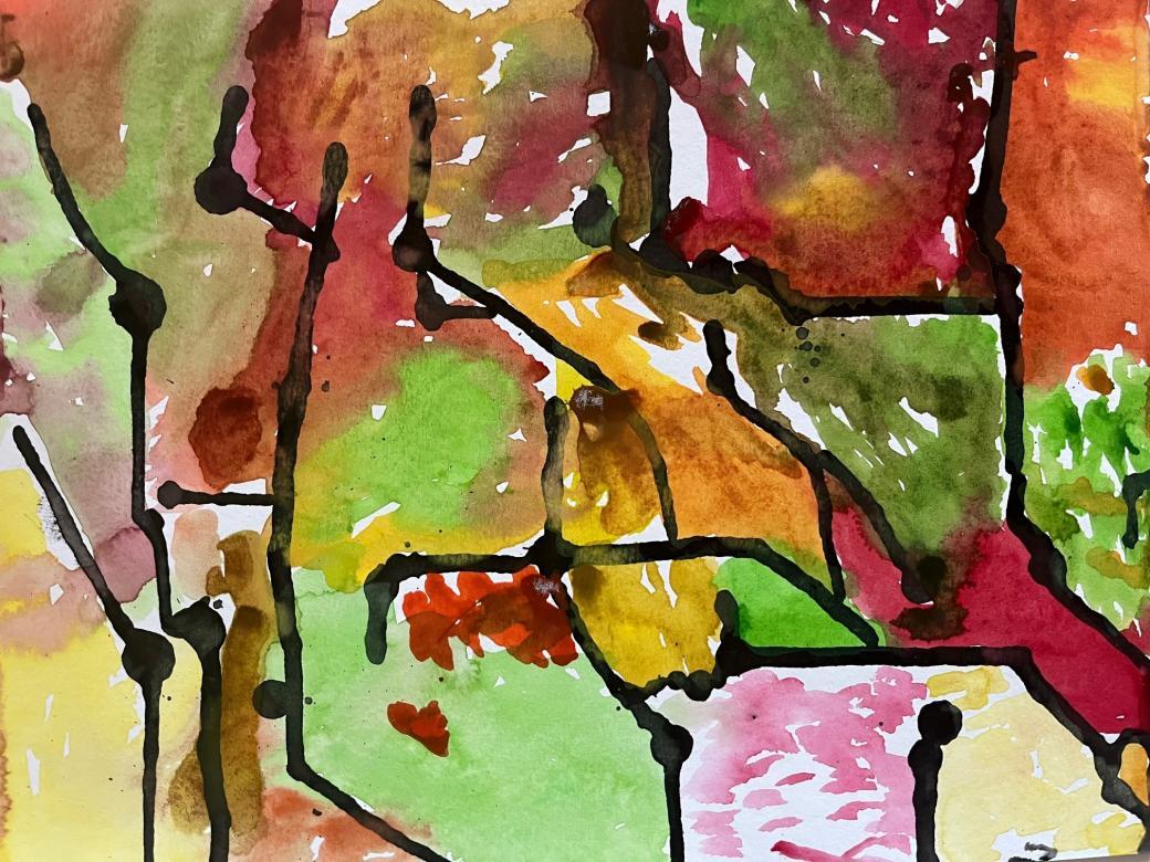 The colors of this piece are green, light orange, dark orange, red, pink, and yellow. They are painted in distinct sections throughout the piece with some small places where they mix. Some of these sections are separated by lines of black paint while others run together.