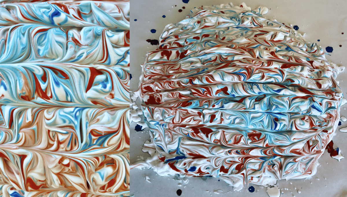 Shaving cream shaped into a round shape of cake with red and blue food coloring swirled and marbled up and down in horizontal rows. On the left side is a close-up of the center of the shaving cream cake. 