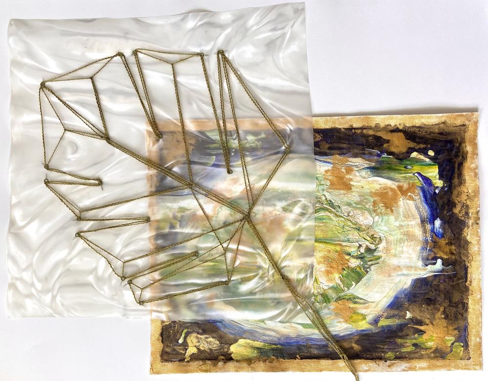 A mixed media piece showing a small rectangular abstract leaf like painting in the bottom right corner made up of purple, gold, blue, and green colors. Overlayed is a transparent plastic film in the top left corner with a leaf embroidered in golden yarn.