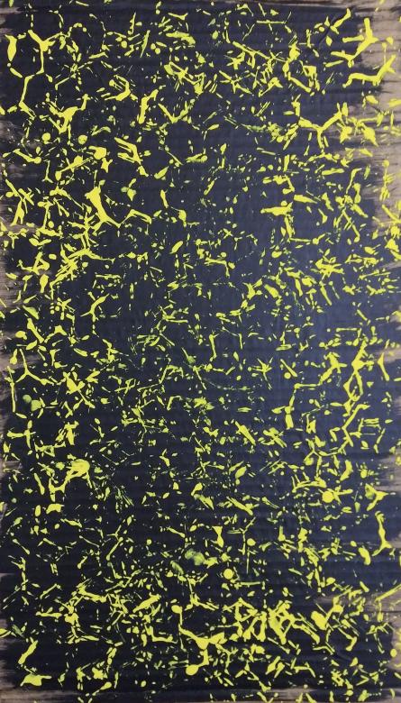Abstract black painting on cardboard with yellow honeycomb like pattern and splatter overlayed across the piece. 
