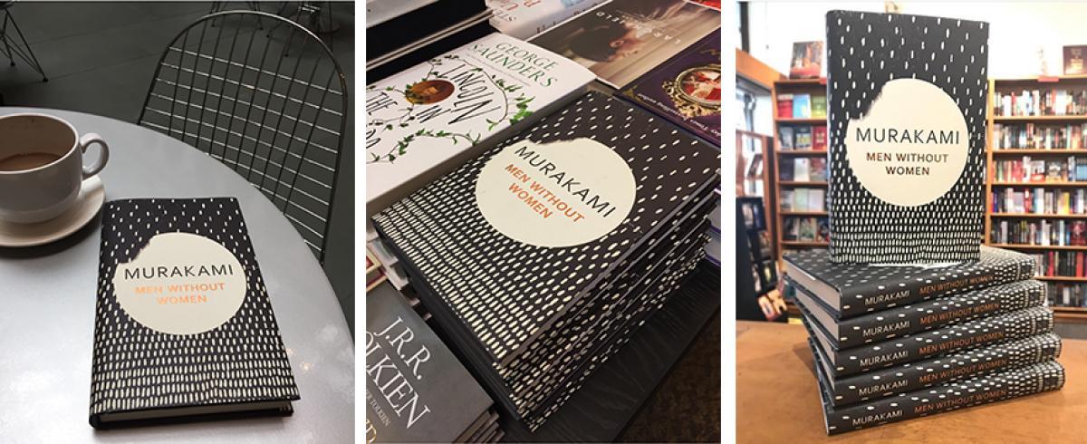 hard cover copy of the book Men Without Women. Cover is dark gray with a collage of lightly colored ovals and a large white circle in the center with the title inside.