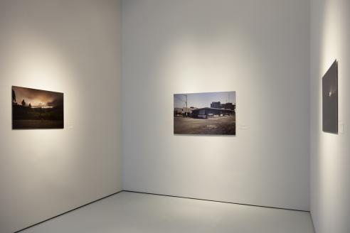 photograph of photographs hanging in gallery 