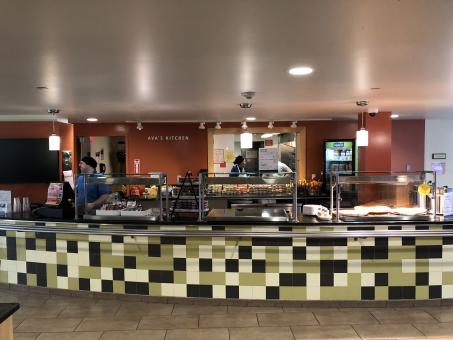 A view of the Student Center cafe with the words Ava's Kitchen on the rear wall.