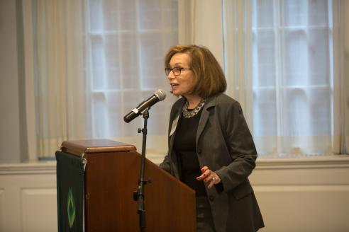  Deborah Schwartz Raizes speaks at a podium in Alumni Hall