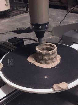 3D clay printer makes a clay vessel 