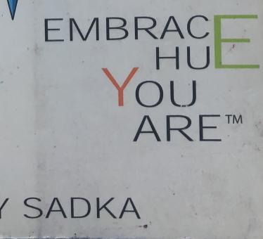 A quote that says "Embrace HuE You Are-TM."