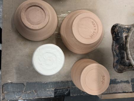 Four bisque-fired pieces in three different types of clay.