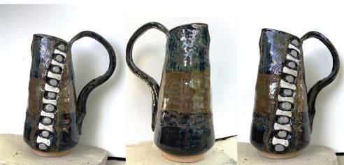 Three different angles of a blue and brown pitcher made from clay and fired with glaze