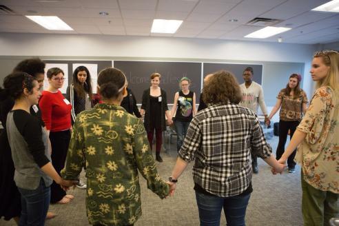 Circle of students holding hands