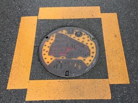 Manhole cover with fire truck