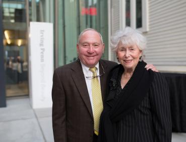 Peter and Paula Lunder pose in front of the Lunder Arts Center
