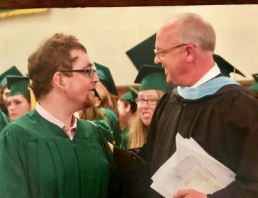 Daniel Dubinsky and Jim Wilbur in academic regalia at Threshold graduation