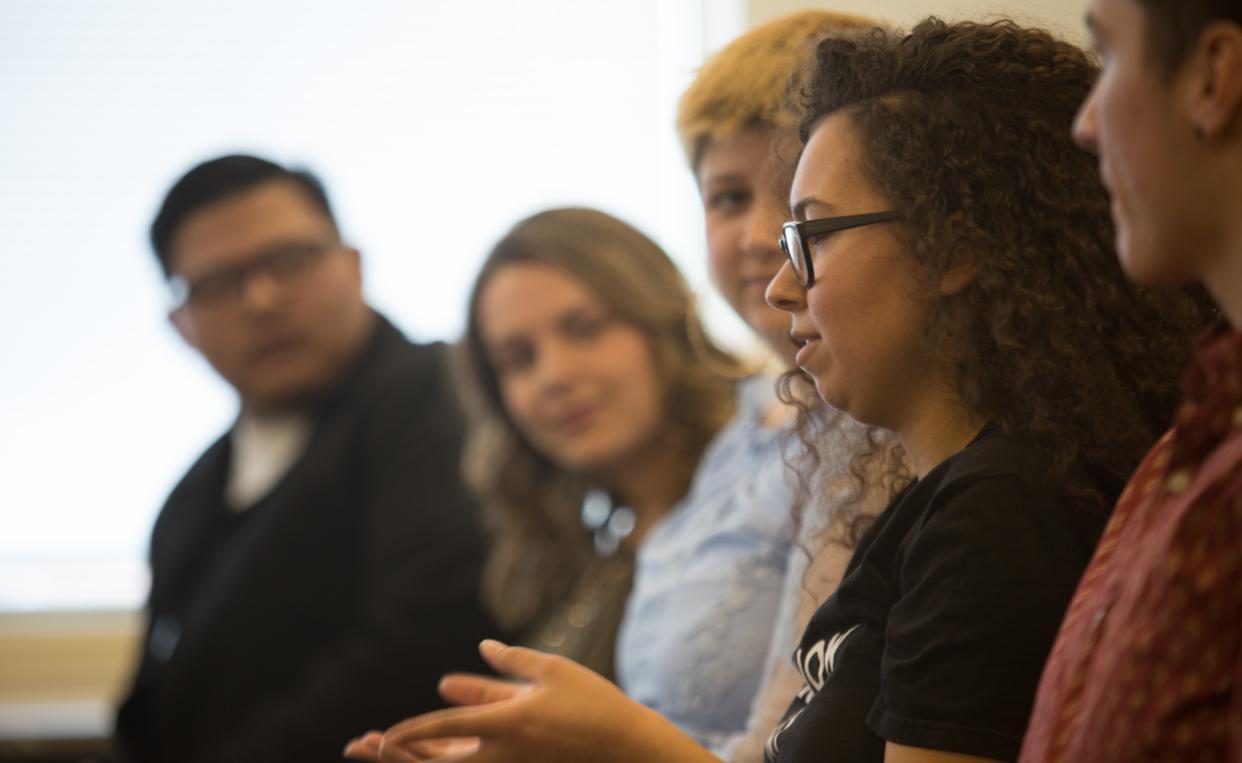 Group of Lesley University students in class conversating. 