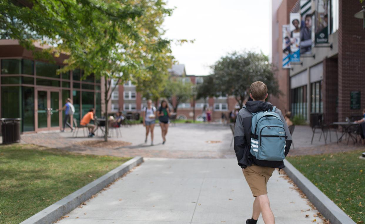 Lesley student walking through Doble.