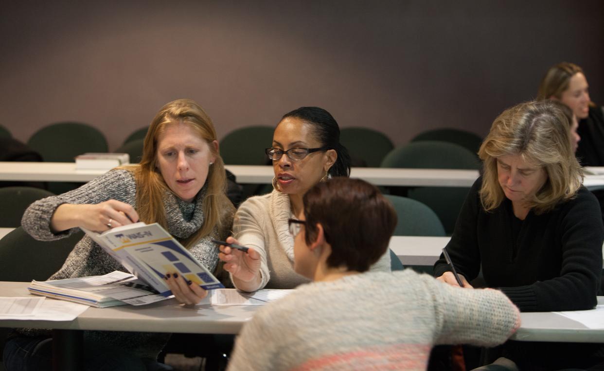 Lesley graduate students collaborating together.