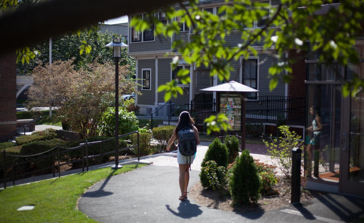 student walking on doble campus
