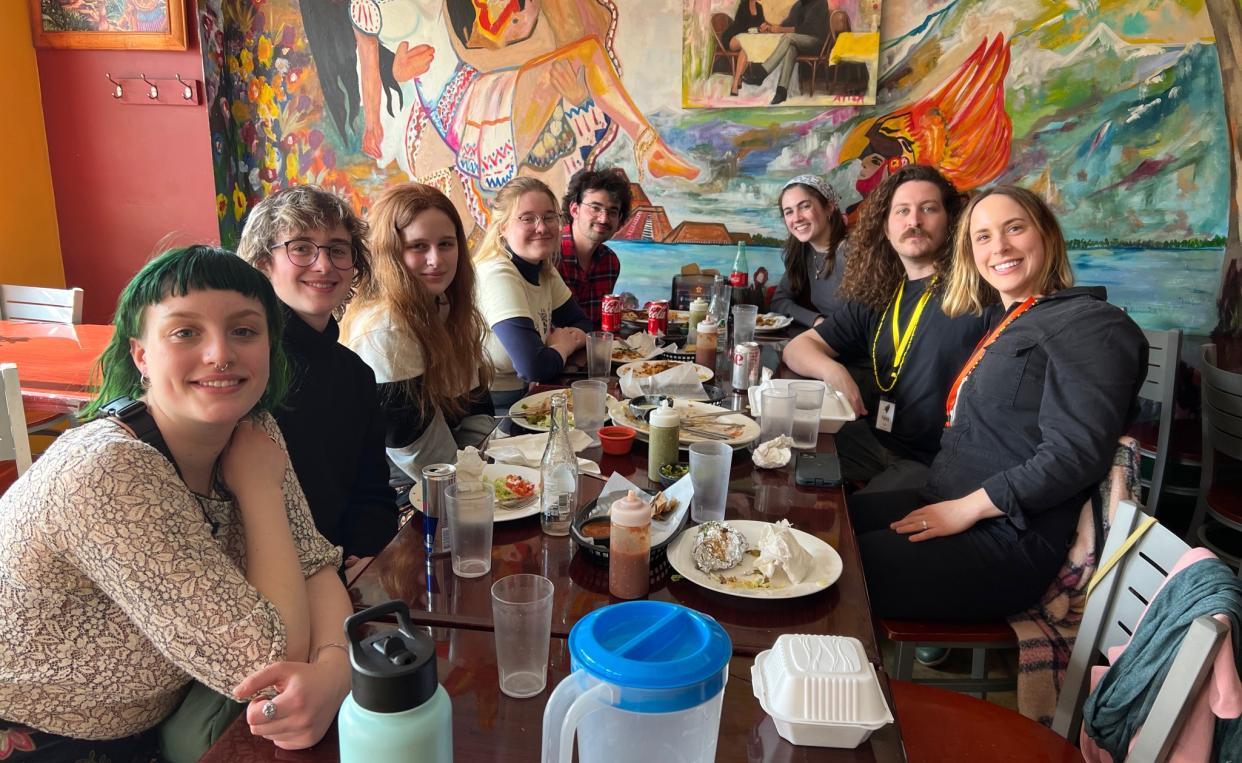 Group photo at a table at a restaurant