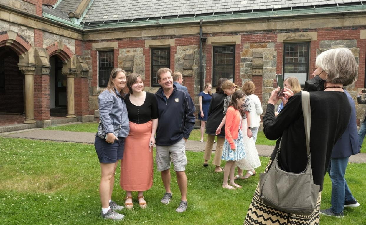 students pose for photos