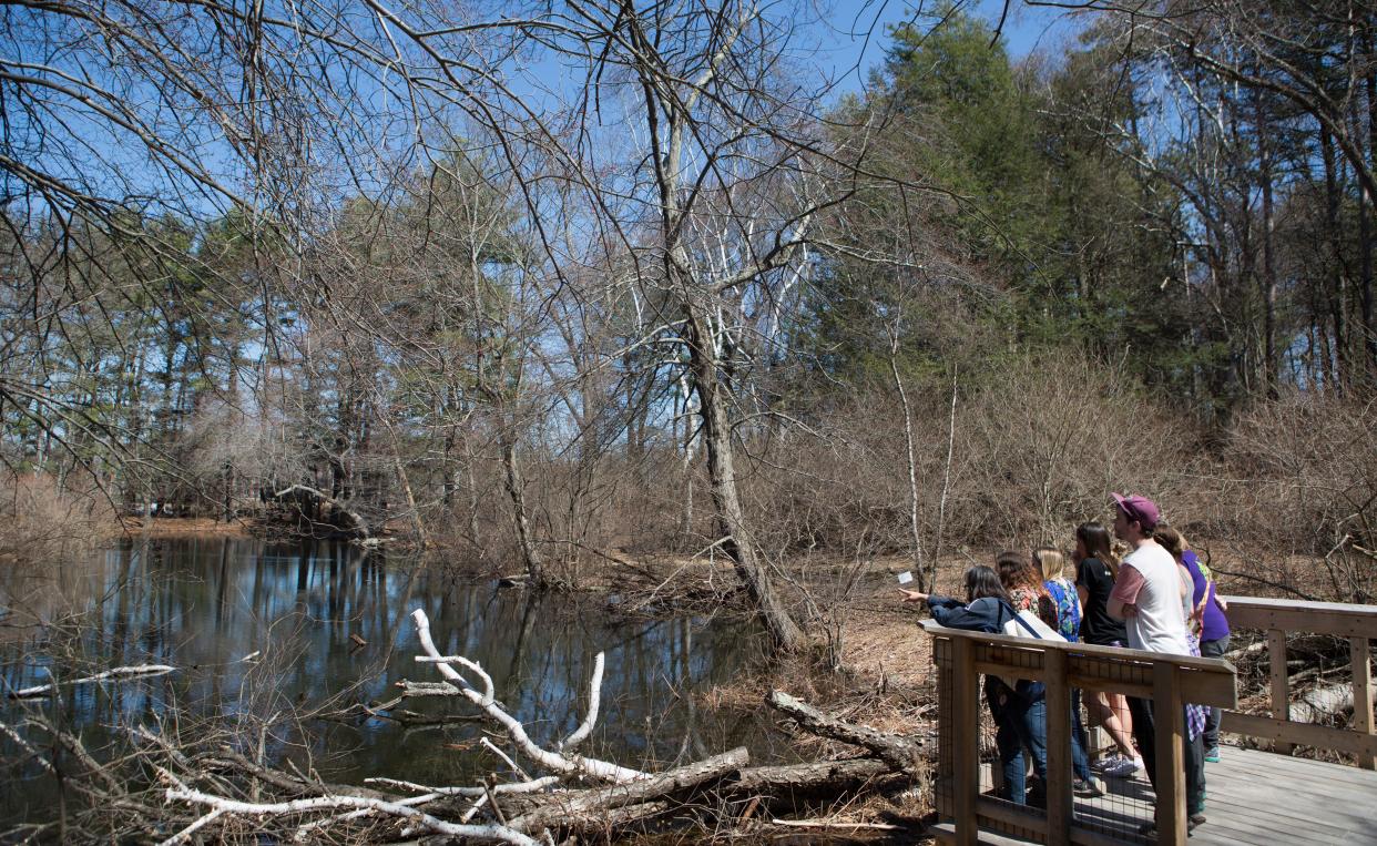 students from an environmental science class outside in a group