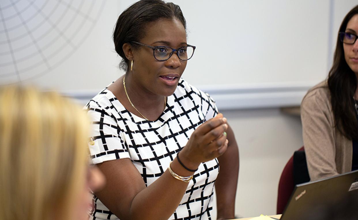 Three students participating in class discussion