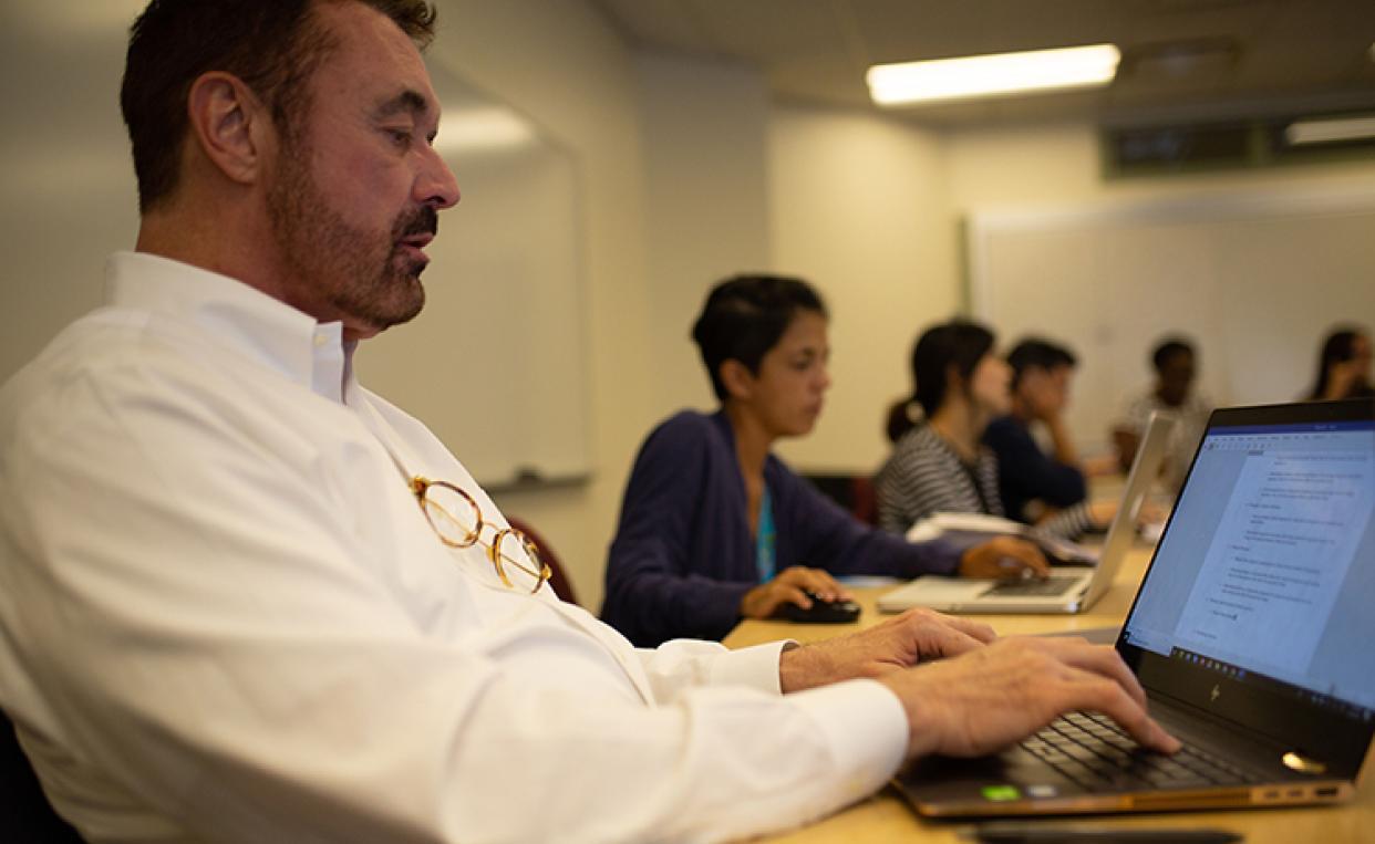 Row of students at laptops