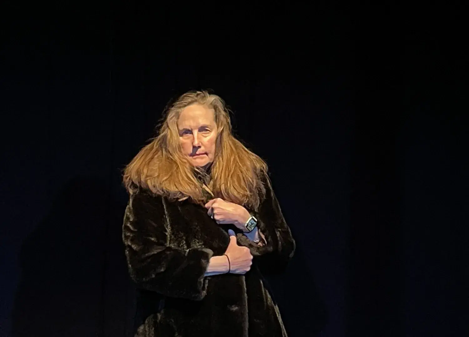Jo-Anne Hart with microphone in black box theater